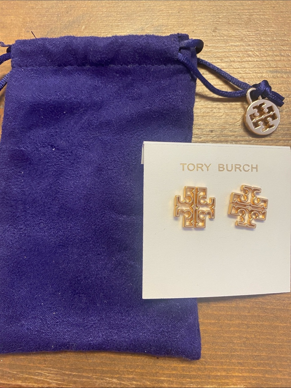 Tory Burch Gold Logo Stud Earrings with Purple Suede Pouch